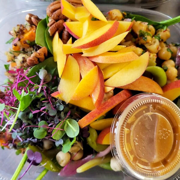 Chef-made bowl with microgreens, fresh fruit and grains. Chef-made bowl with microgreens, fresh fruit and grains.