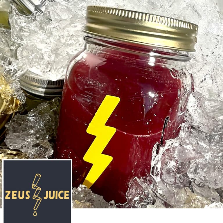 A jar of fresh cold-pressed juice on ice.
